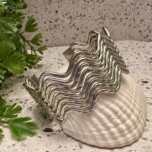 Silver tone metal open cuff bangle bracelet